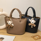 Upgrade your accessories with this new bucket bag for women. Featuring a fashionable and versatile design, this handheld bag is perfect for adding a chic and trendy touch to your look. -