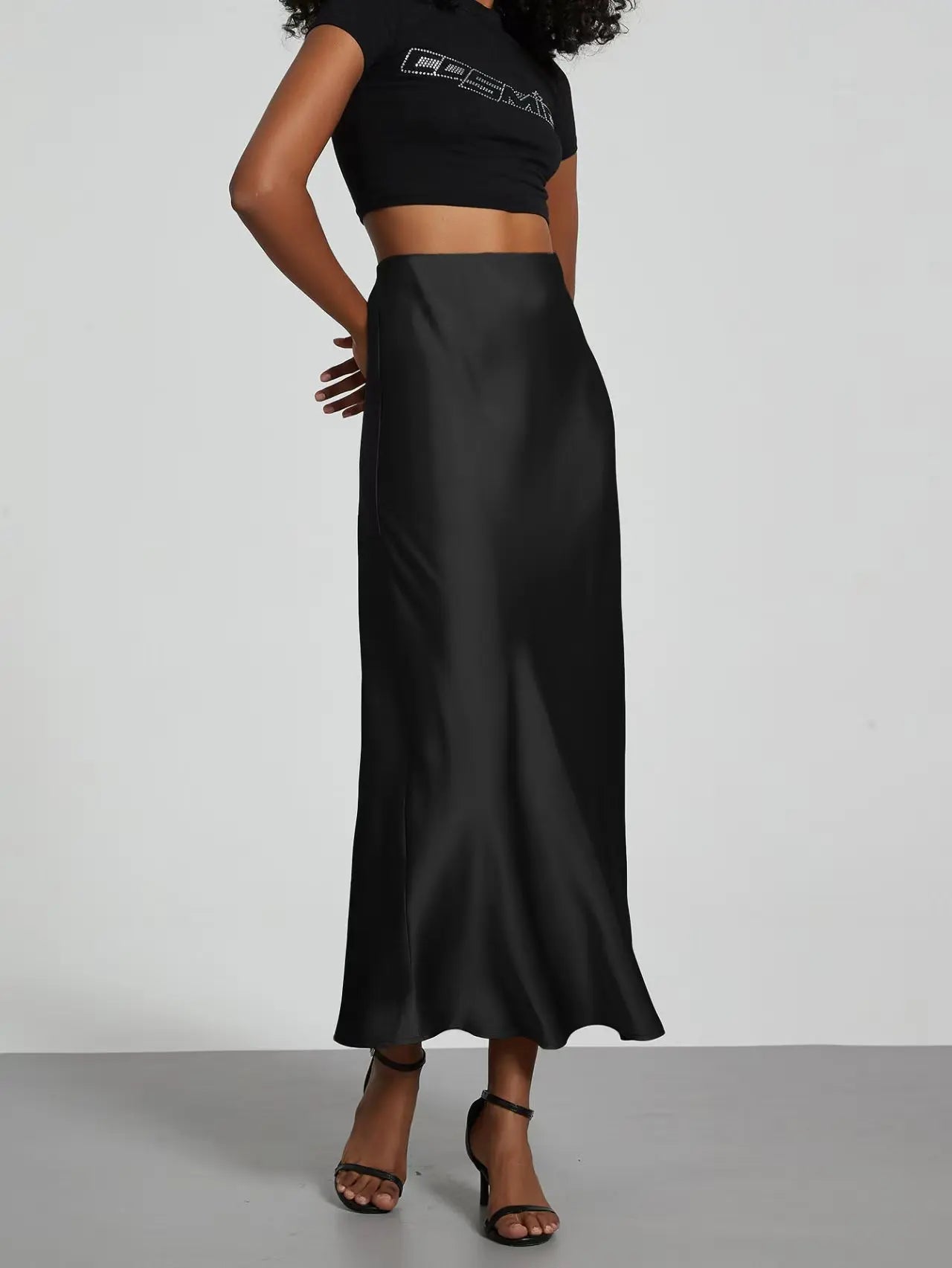 Elevate your elegance with this sleek black satin skirt for women—perfect for any occasion! -