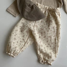 Keep your little ones comfy and cute in these organic cotton loose-fit baby pants—featuring playful tiger, bear, and floral prints perfect for boys and girls! -