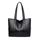 Carry all your essentials in style with this large capacity tote bag designed for women. The single shoulder handbag is crafted from soft leather, providing a chic and versatile accessory for any outfit. -