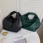 Make a stylish statement with these large shoulder bags designed for women. Crafted from soft leather, these fashionable handbags are perfect for adding a touch of sophistication to any outfit. -