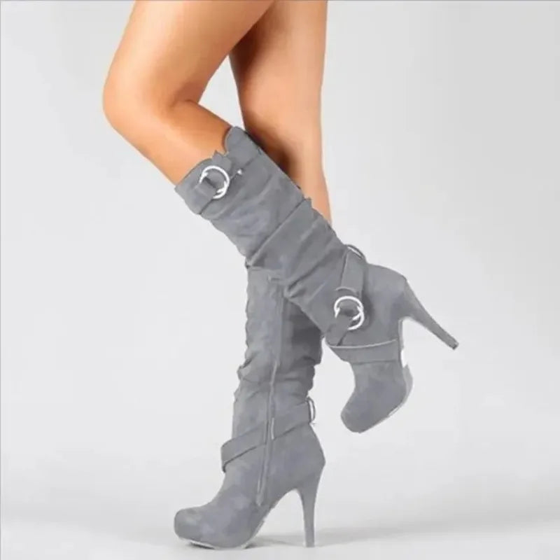 Make a statement with these new sexy knee-high women boots featuring thin, high heels. Perfect for adding a touch of elegance and style to any outfit! -
