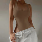 Achieve a hot and sexy look with this sleeveless knit bodysuit featuring an off-shoulder halter design. Perfect for making a stylish and alluring statement! -