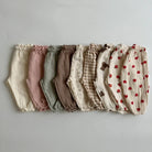 Keep your little ones comfy and cute in these organic cotton loose-fit baby pants—featuring playful tiger, bear, and floral prints perfect for boys and girls! -