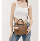Upgrade your accessories with this new bucket bag for women. Featuring a fashionable and versatile design, this handheld bag is perfect for adding a chic and trendy touch to your look. -