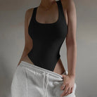 Achieve a hot and sexy look with this sleeveless knit bodysuit featuring an off-shoulder halter design. Perfect for making a stylish and alluring statement! -