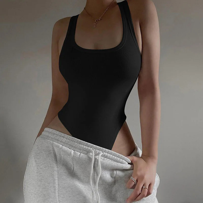 Achieve a hot and sexy look with this sleeveless knit bodysuit featuring an off-shoulder halter design. Perfect for making a stylish and alluring statement! -