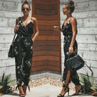 Dress to impress in this sexy and stylish women's summer jumpsuit. Featuring a backless design, deep V-neckline, floral print, and strappy details, this romper is perfect for making a statement with your outfit! -