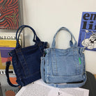 Elevate your casual look with this denim shoulder bag for women. Featuring a large design and zipper closure, this bag is perfect for shopping and everyday use, adding a touch of style to your outfit. -