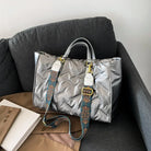 Stay on-trend with this fashion-forward large tote padded handbag featuring a designer quilted design. This stylish accessory is perfect for adding a touch of sophistication and elegance to your ensemble. -