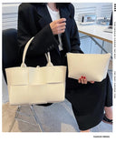 Make a fashion statement with this large capacity handbag. Crafted with stylish woven leather, this tote bag is perfect for adding a touch of elegance to your everyday outfit. -