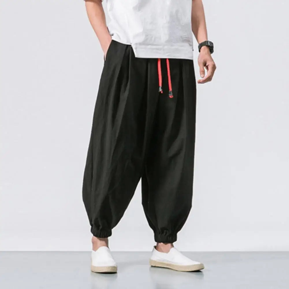Stay comfortable and stylish in these men's baggy jogging pants featuring a drawstring waist—an ideal choice for a relaxed and casual look! -