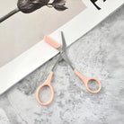 Eyebrow trimming scissors with built-in comb -
