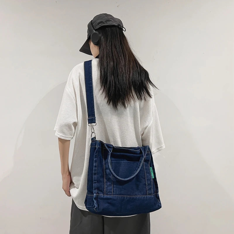 Elevate your casual look with this denim shoulder bag for women. Featuring a large design and zipper closure, this bag is perfect for shopping and everyday use, adding a touch of style to your outfit. -