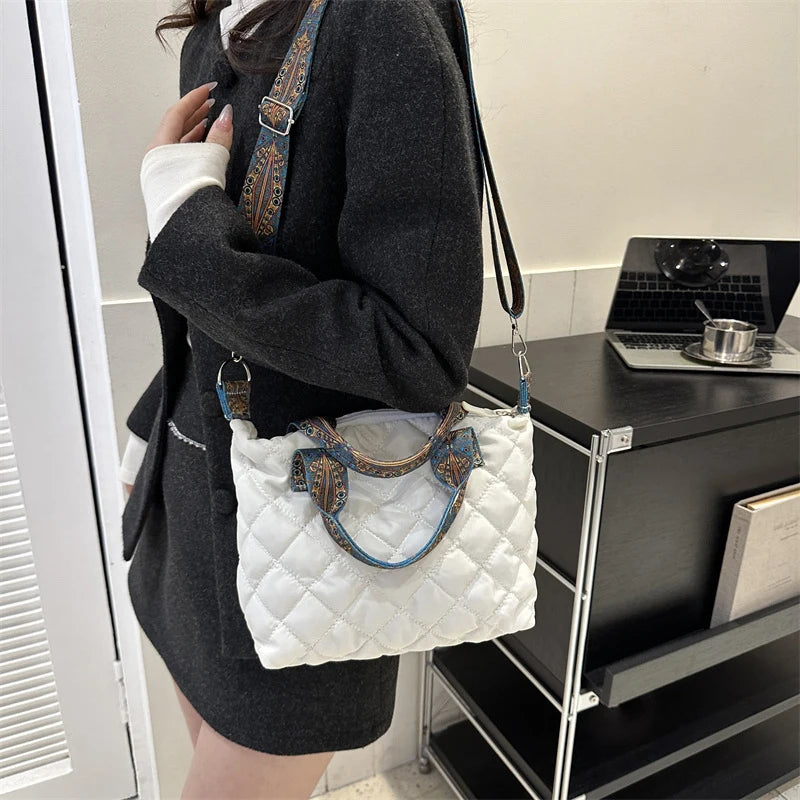 Elevate your style with these luxury designer shoulder crossbody bags for women. Featuring a quilted padded design from a top designer brand, these handbags are perfect for adding a touch of elegance to any outfit. -