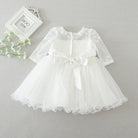 Make your baby girl shine in this elegant long-sleeve white party dress—perfect for special occasions! -