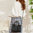 Carry your essentials in style with this versatile women's tote bag. Featuring a large capacity and made from casual PU leather, this crossbody handbag is perfect for adding a fashionable touch to your everyday look. -