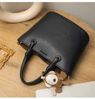 Upgrade your accessories with this new bucket bag for women. Featuring a fashionable and versatile design, this handheld bag is perfect for adding a chic and trendy touch to your look. -