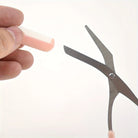 Eyebrow trimming scissors with built-in comb -