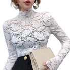 Achieve an elegant and feminine look with this long sleeve lace crochet top. The see-through design adds a touch of allure and sophistication to your outfit. -