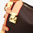 Make a statement with this luxurious and elegant box bag for women. Crafted from high-quality leather, this shoulder handbag features an elegant top-handle design, exuding sophistication and style for a classy finishing touch to your ensemble. -