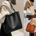 Elevate your style with these retro-inspired bucket shoulder bag made of real leather. -
