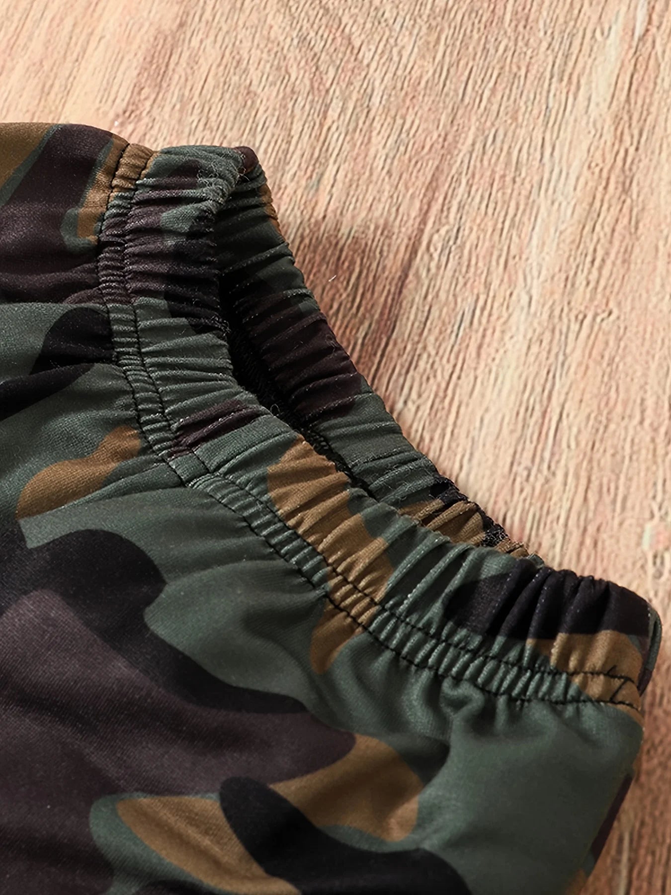 Dress your little guy sharp and comfy with this two-piece baby boy set—long-sleeved round neck top paired with stylish camouflage pants! -