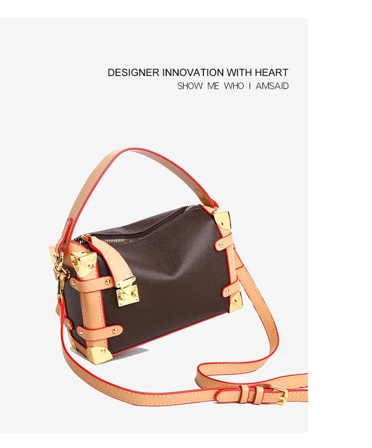 Make a statement with this luxurious and elegant box bag for women. Crafted from high-quality leather, this shoulder handbag features an elegant top-handle design, exuding sophistication and style for a classy finishing touch to your ensemble. -