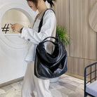Make a stylish statement with these large shoulder bags designed for women. Crafted from soft leather, these fashionable handbags are perfect for adding a touch of sophistication to any outfit. -
