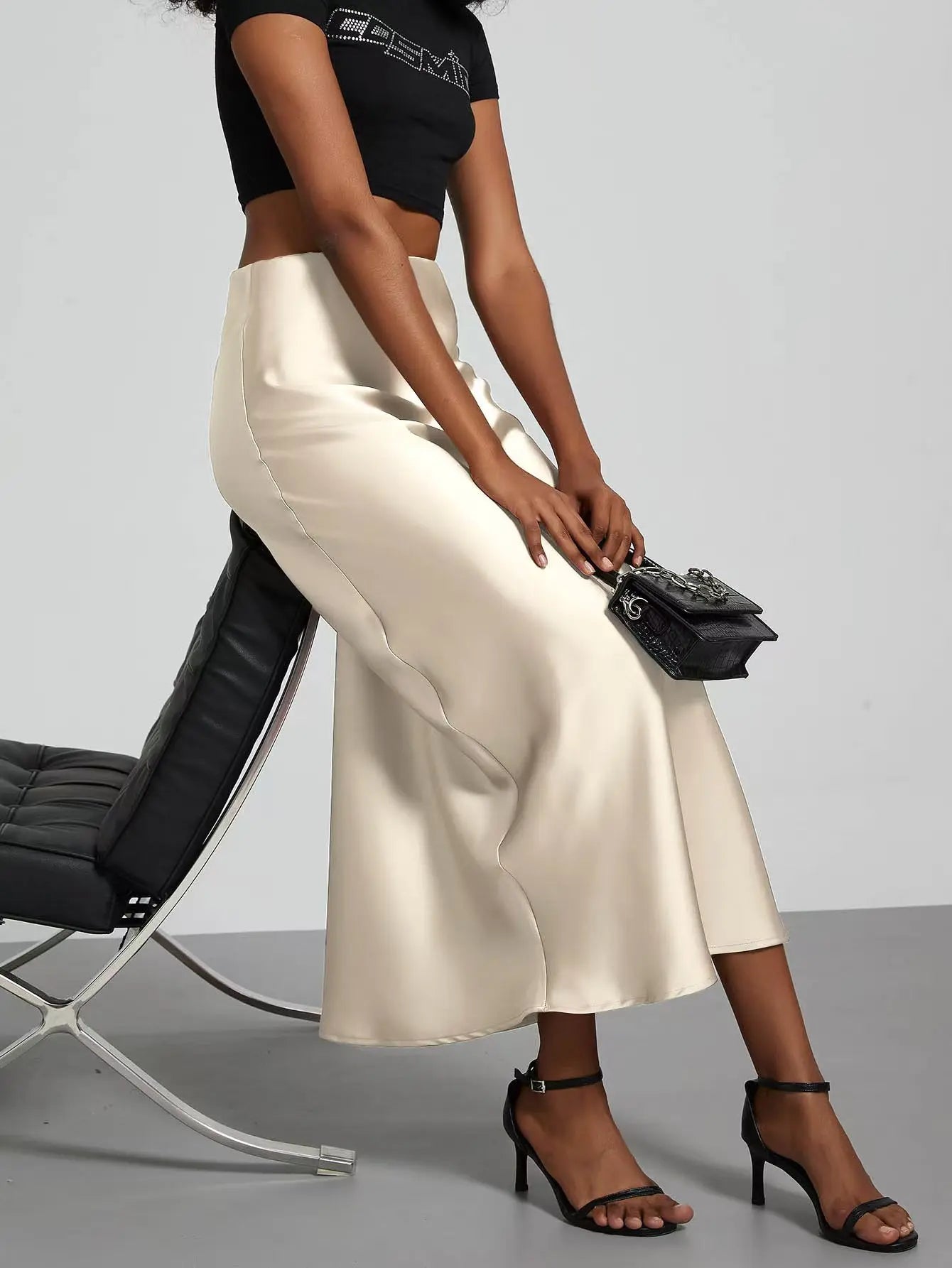 Elevate your elegance with this sleek black satin skirt for women—perfect for any occasion! -
