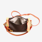 Make a statement with this luxurious and elegant box bag for women. Crafted from high-quality leather, this shoulder handbag features an elegant top-handle design, exuding sophistication and style for a classy finishing touch to your ensemble. -