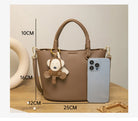 Upgrade your accessories with this new bucket bag for women. Featuring a fashionable and versatile design, this handheld bag is perfect for adding a chic and trendy touch to your look. -