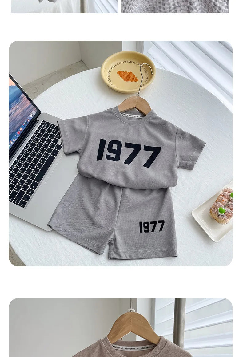 Dress your little athletes in style with this trendy two-piece set—featuring printed short-sleeve tops and shorts for both boys and girls! -