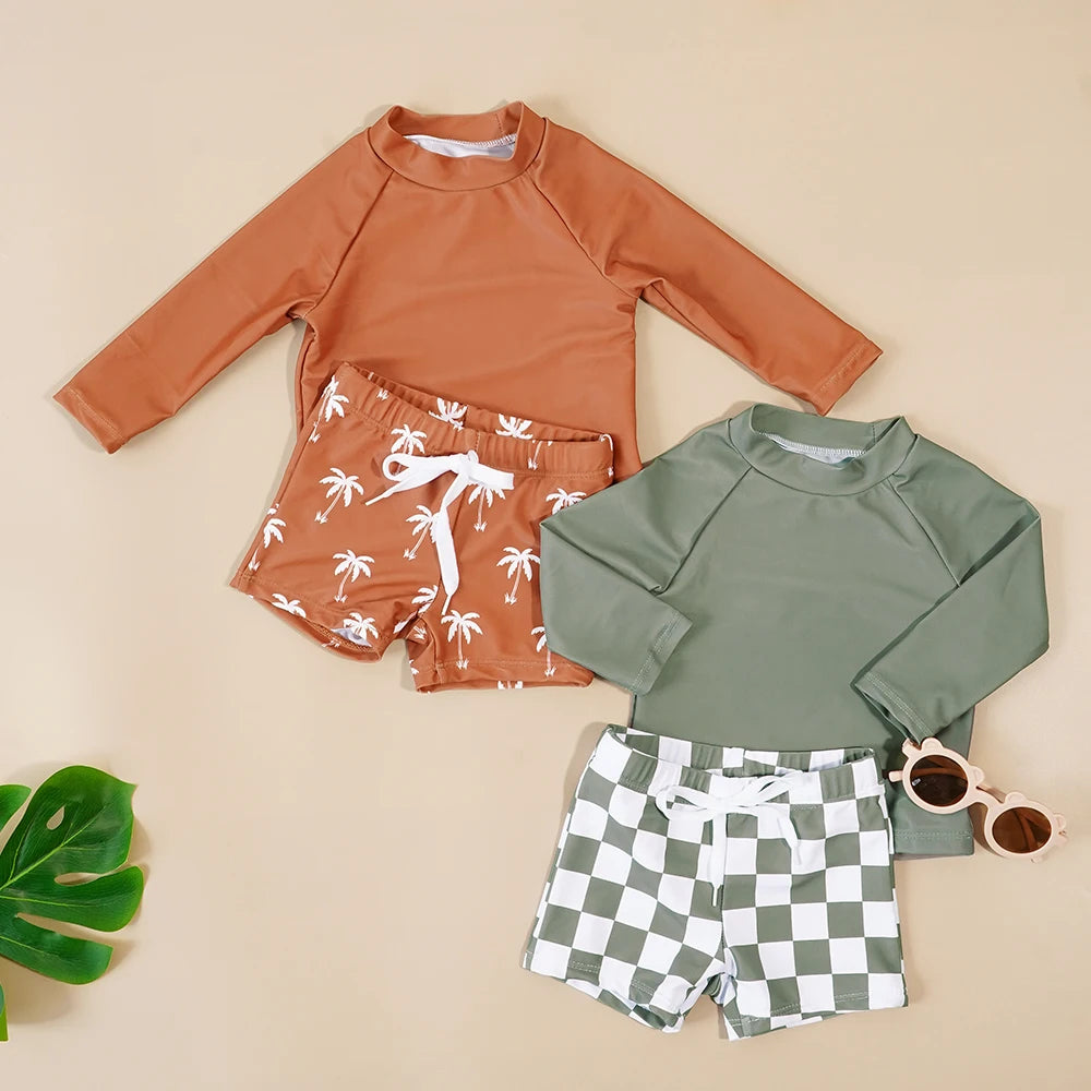 Make a splash in style with this fashionable and cute long-sleeve swimsuit for baby boys and girls—perfect for pool days and swim fun! -
