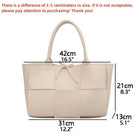 Make a fashion statement with this large capacity handbag. Crafted with stylish woven leather, this tote bag is perfect for adding a touch of elegance to your everyday outfit. -