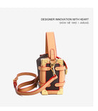 Make a statement with this luxurious and elegant box bag for women. Crafted from high-quality leather, this shoulder handbag features an elegant top-handle design, exuding sophistication and style for a classy finishing touch to your ensemble. -