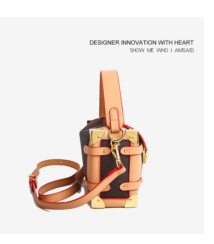Make a statement with this luxurious and elegant box bag for women. Crafted from high-quality leather, this shoulder handbag features an elegant top-handle design, exuding sophistication and style for a classy finishing touch to your ensemble. -