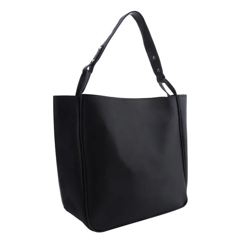 Elevate your style with these retro-inspired bucket shoulder bag made of real leather. -