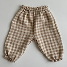Keep your little ones comfy and cute in these organic cotton loose-fit baby pants—featuring playful tiger, bear, and floral prints perfect for boys and girls! -
