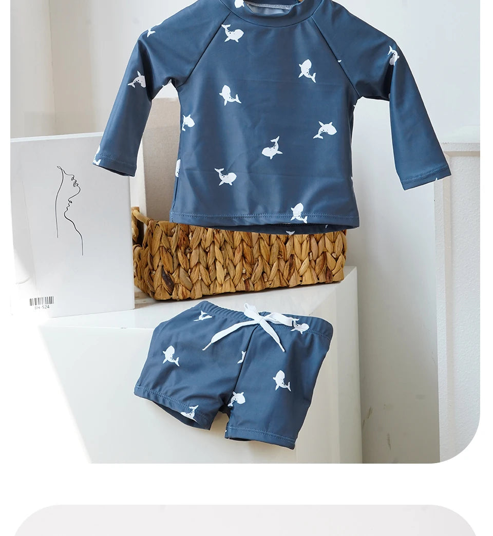 Make a splash in style with this fashionable and cute long-sleeve swimsuit for baby boys and girls—perfect for pool days and swim fun! -