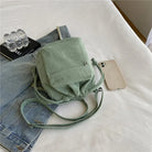 Carry your essentials in style with this cute middle shoulder drawstring bucket bag—a versatile and fashionable accessory for women on the go! -