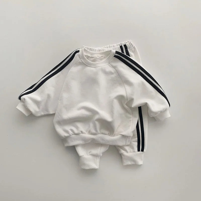 Keep your little one stylish and comfy with this cool two-piece baby suit—featuring a letter-printed zip-up top and matching leisure sports pants! -