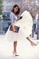 Add volume and elegance to your outfit with this knee-length underskirt—perfect for enhancing dresses and skirts for a fuller look! -
