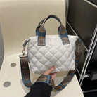 Elevate your style with these luxury designer shoulder crossbody bags for women. Featuring a quilted padded design from a top designer brand, these handbags are perfect for adding a touch of elegance to any outfit. -
