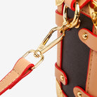Make a statement with this luxurious and elegant box bag for women. Crafted from high-quality leather, this shoulder handbag features an elegant top-handle design, exuding sophistication and style for a classy finishing touch to your ensemble. -