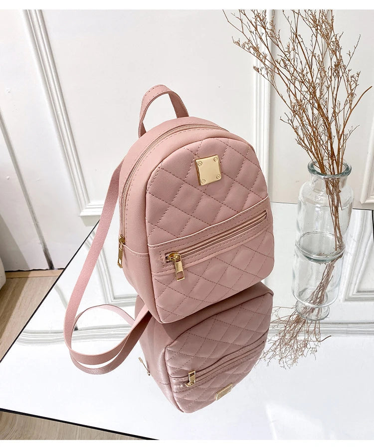 Carry your essentials in style with this fashionable women's bag. Featuring double pockets and embroidered details, this small book bag is perfect for adding a trendy touch to your outfit. -