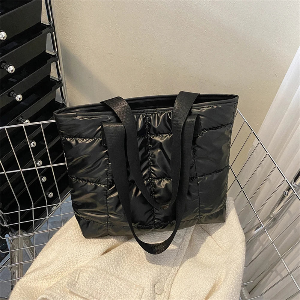 Stay stylish and organized with this fashion women's tote bag. Featuring a large capacity and cotton-padded design, this chic accessory is perfect for women who prioritize both style and functionality in their handbag. -