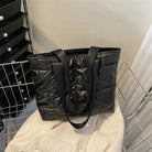 Stay stylish and organized with this fashion women's tote bag. Featuring a large capacity and cotton-padded design, this chic accessory is perfect for women who prioritize both style and functionality in their handbag. -