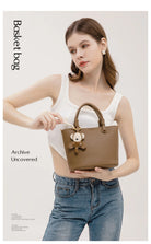 Upgrade your accessories with this new bucket bag for women. Featuring a fashionable and versatile design, this handheld bag is perfect for adding a chic and trendy touch to your look. -