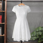 Make a chic statement with this elegant women's dress featuring an O-neck design, transparent lace, and hollow detail—a perfect choice for a sophisticated and stylish look. -